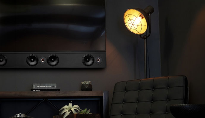 A luxury media lounge featuring a wall-mounted flat screen television