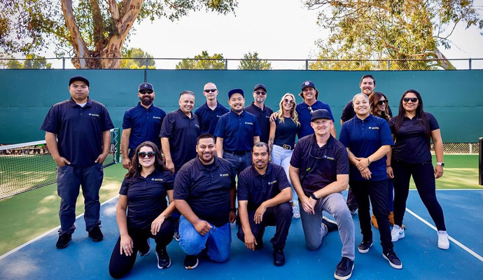 Digital Installers team group photo on tennis court