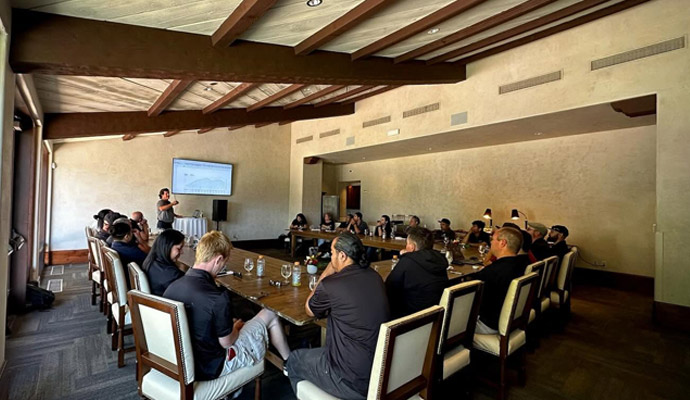 Employee training presentation in beamed meeting room