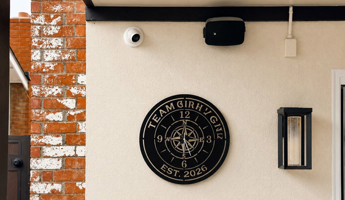 Exterior wall with security camera outdoor speaker and light