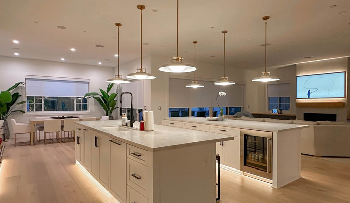 Modern white kitchen with double islands and pendant lights