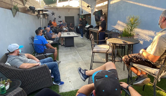 Outdoor patio lunch and learn presentation with audience