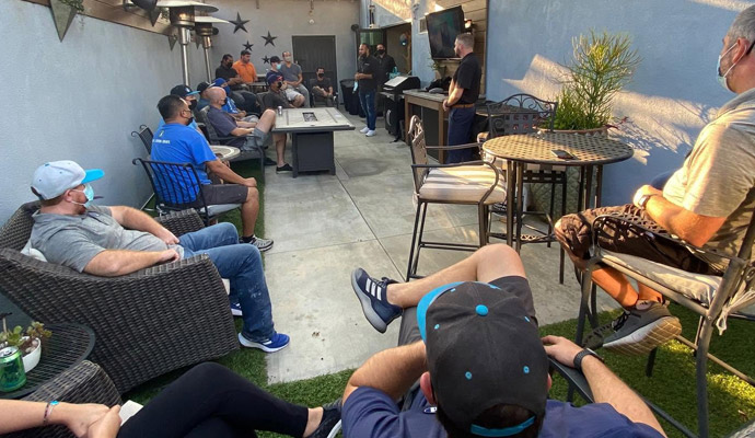 Outdoor patio presentation with audience