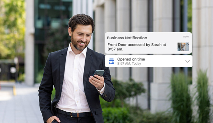 Business owner receiving mobile security alert notification