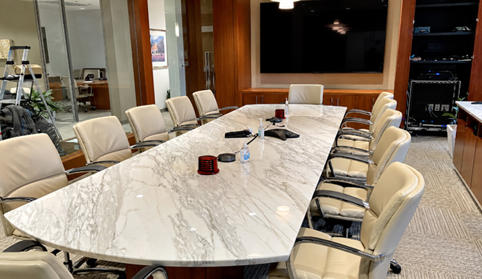 Conference room with AV equipment rack and display