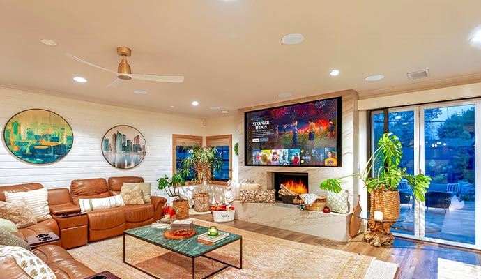Modern living room entertainment space with smart TV Bright modern living room featuring a wall-mounted smart TV for a comfortable entertainment area
