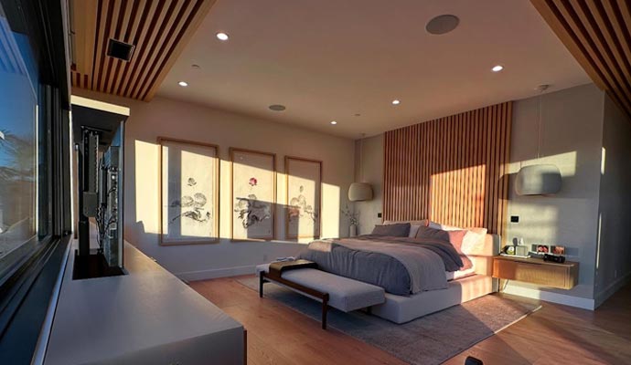 Luxury modern bedroom with big TV and lighting
