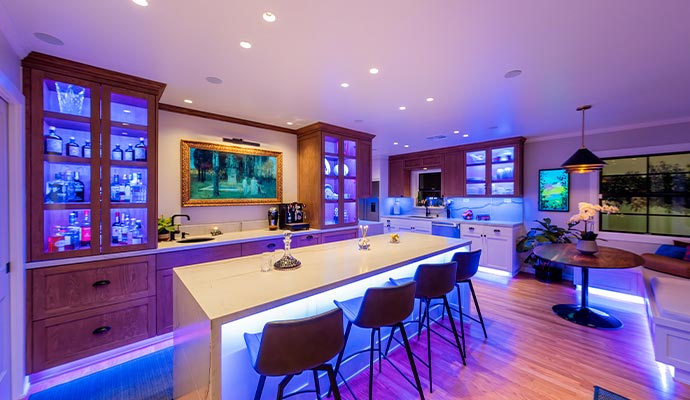 Modern kitchen and dining area with LED lighting