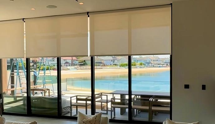 Modern waterfront living room with big windows