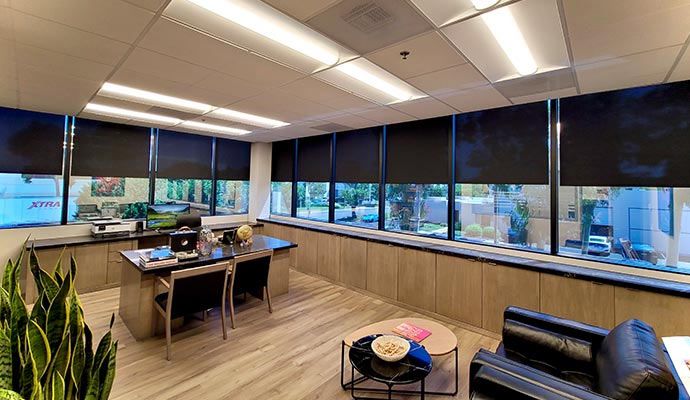 Modern room with motorized window coverings for optimal light control