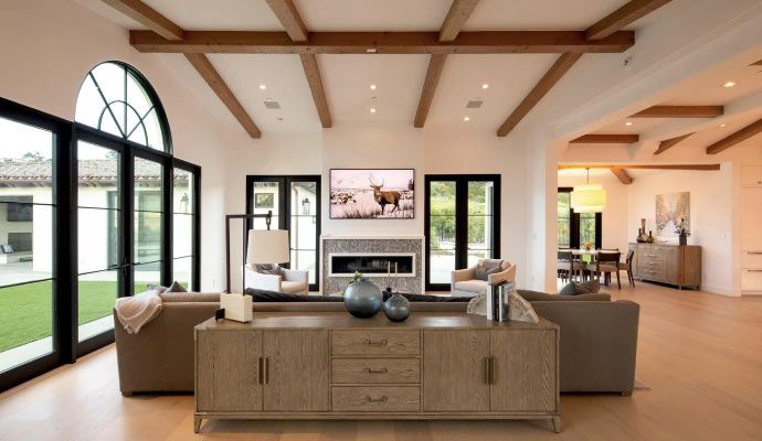 Modern living room interior with wall-mounted TV and ambient lighting