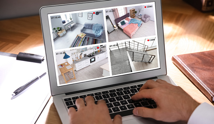 Laptop displaying cloud-connected home security cameras