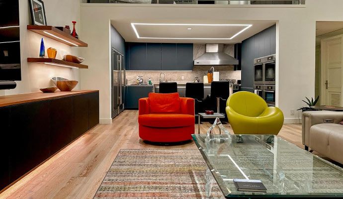 Installed linear ceiling lighting in modern living room