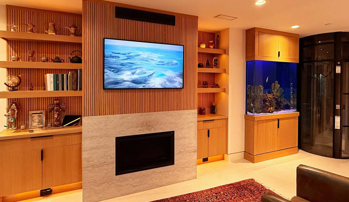 Living room fireplace wall with linear accent lighting