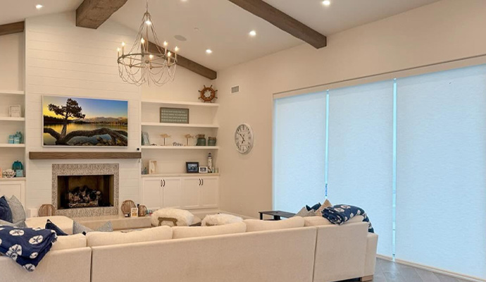 Living room with motorized window roller shade