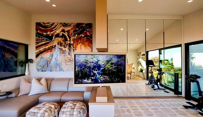 Modern entertainment room with motorized window shades