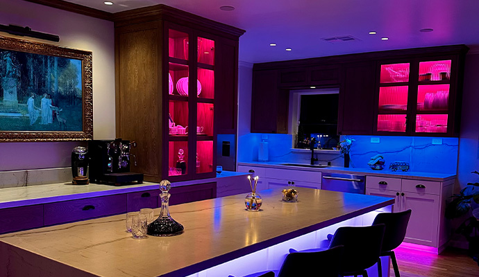 Modern kitchen with color changing linear LED lighting