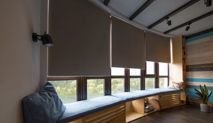 Motorized window roller shades on panoramic windows
