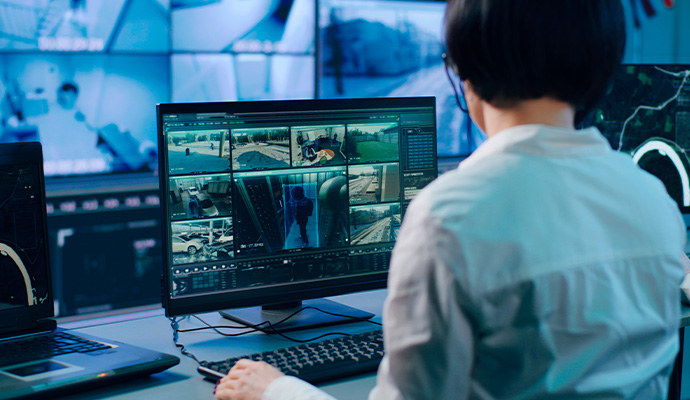 Operator monitoring CCTV video surveillance screen