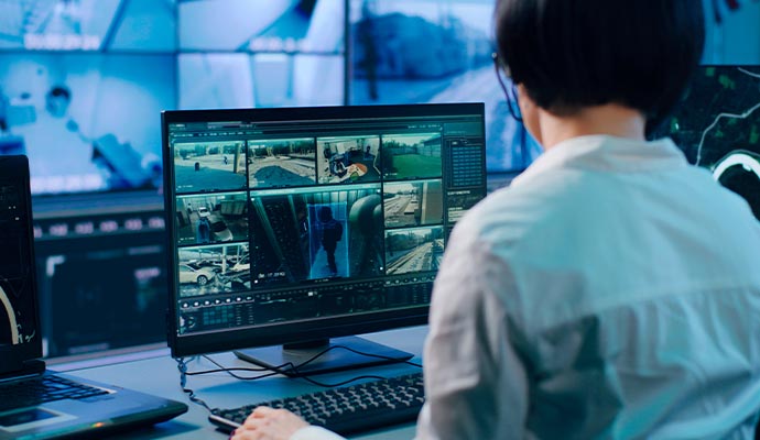 Security professional monitoring CCTV surveillance