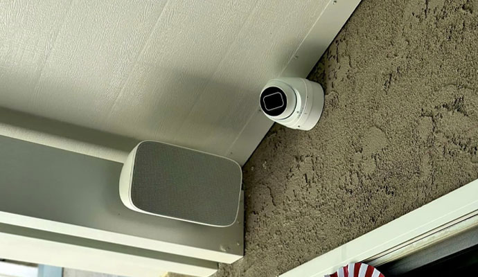 Outdoor security camera installed under patio roof