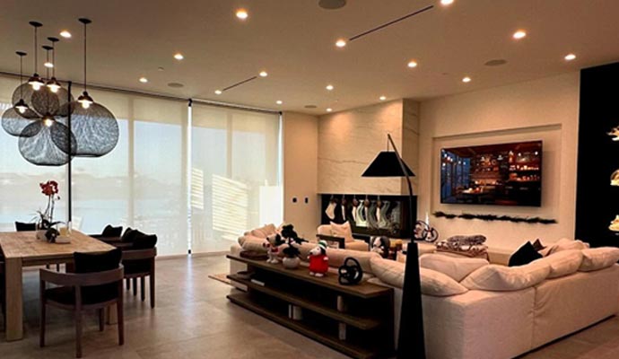 Smart living room with fireplace and pendant lights