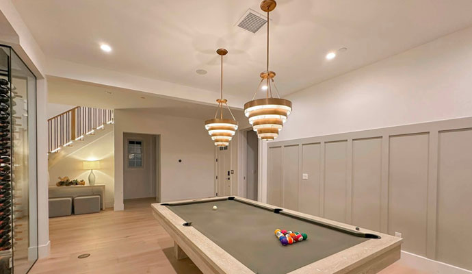 Spacious game room location with billiard table