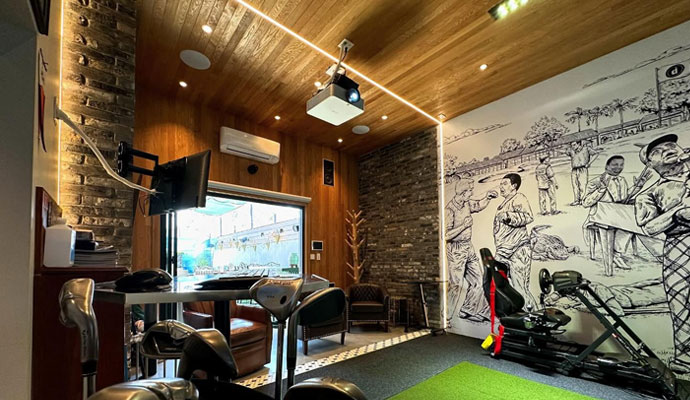 Ultimate home game room with golf and racing simulator